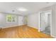 Bright living room with neutral walls, hardwood floors, a view of the door and windows with outdoor views at 1738 Taylor Nw St # B2, Atlanta, GA 30318
