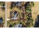 Aerial view of a home with a long driveway and mature trees at 1874 Mcgarity Rd, Mcdonough, GA 30252