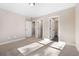 Bedroom with multiple closets and doorways leading to other rooms at 1874 Mcgarity Rd, Mcdonough, GA 30252