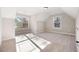 Well-lit bedroom with soft carpeting, bright double hung windows, and angled walls at 1874 Mcgarity Rd, Mcdonough, GA 30252