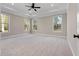 Bright and spacious bedroom with large windows and carpet floors at 1874 Mcgarity Rd, Mcdonough, GA 30252