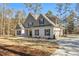 Beautiful two-story home featuring a painted brick facade, well-manicured lawn, and a seamlessly attached two-car garage at 1874 Mcgarity Rd, Mcdonough, GA 30252
