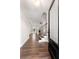 Open foyer with wood floors, staircase with wrought iron railings, and a view into the spacious living area beyond at 1874 Mcgarity Rd, Mcdonough, GA 30252