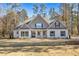 Beautiful single-story home with a large front yard and a charming entrance at 1874 Mcgarity Rd, Mcdonough, GA 30252
