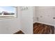 Laundry room features shiplap wall and storage shelf at 1874 Mcgarity Rd, Mcdonough, GA 30252