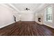 Expansive living room boasts hardwood floors, recessed lighting, and a brick fireplace at 1874 Mcgarity Rd, Mcdonough, GA 30252