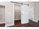 Custom pantry with sliding barn door and built in shelving at 1874 Mcgarity Rd, Mcdonough, GA 30252