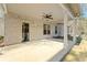 Covered patio area featuring brick and a ceiling fan for outdoor living at 1874 Mcgarity Rd, Mcdonough, GA 30252
