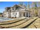Single-story home with a large backyard and a covered patio at 1874 Mcgarity Rd, Mcdonough, GA 30252