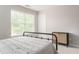 Serene bedroom features a window and a stylish cabinet, perfect for relaxation at 2167 Crestridge Ne Trl, Brookhaven, GA 30329