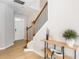 Bright entryway features hardwood floors, staircase with modern railings, and decorative console table at 2167 Crestridge Ne Trl, Brookhaven, GA 30329