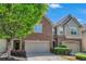 Two-story townhome showcasing brick and shingle facade, with attached garage and neat landscaping at 2167 Crestridge Ne Trl, Brookhaven, GA 30329