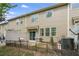 Exterior townhome view with patio, grill, and fenced-in yard at 2167 Crestridge Ne Trl, Brookhaven, GA 30329