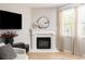 Elegant fireplace with a white mantle and modern decor in a naturally lit living space at 2167 Crestridge Ne Trl, Brookhaven, GA 30329