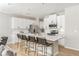 Modern kitchen features white cabinets, stainless steel appliances, and a large island with bar seating at 2167 Crestridge Ne Trl, Brookhaven, GA 30329