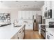 Bright kitchen boasting stainless appliances, white cabinets, and a spacious island with seating at 2167 Crestridge Ne Trl, Brookhaven, GA 30329