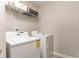 Laundry room equipped with modern appliances and a wire shelf for storage at 2167 Crestridge Ne Trl, Brookhaven, GA 30329