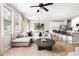 Open-concept living area with hardwood floors and a modern kitchen featuring stainless steel appliances at 2167 Crestridge Ne Trl, Brookhaven, GA 30329