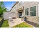 Outdoor patio area featuring a grill, seating, and a privacy fence at 2167 Crestridge Ne Trl, Brookhaven, GA 30329