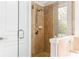 Elegant tiled shower with glass door and updated fixtures inside a modern bathroom at 2167 Crestridge Ne Trl, Brookhaven, GA 30329