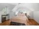 Bedroom with wood floors, ceiling fan, and window-side vanity desk at 2515 Ridgewood Nw Rd, Atlanta, GA 30318