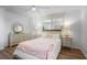 Bright bedroom features wood floors, ceiling fan, and a sun-filled window at 2515 Ridgewood Nw Rd, Atlanta, GA 30318