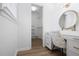 Dressing room with vanity, accent mirror, drawers, and access to the walk-in closet at 2515 Ridgewood Nw Rd, Atlanta, GA 30318