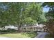 Charming home with large tree and welcoming front porch perfect for relaxing and curb appeal at 2515 Ridgewood Nw Rd, Atlanta, GA 30318