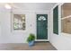 Charming front door with green shutters, brick accents, and a front window at 2515 Ridgewood Nw Rd, Atlanta, GA 30318