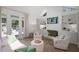 Sun-filled living room featuring built-in shelving, a cozy fireplace, and access to a private deck through glass doors at 2515 Ridgewood Nw Rd, Atlanta, GA 30318
