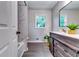 Modern bathroom showcasing a vanity with granite countertop and a marble-tiled shower at 2932 Valley Ridge Dr, Decatur, GA 30032