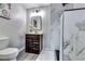 Stylish bathroom featuring a floating vanity, modern lighting, and a frameless glass-enclosed shower at 2932 Valley Ridge Dr, Decatur, GA 30032