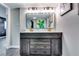 Bathroom features a vanity with a mirror, light fixtures, and barn door storage at 2932 Valley Ridge Dr, Decatur, GA 30032