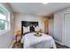 This bedroom features a decorative black headboard, wood floors, and an ensuite bathroom at 2932 Valley Ridge Dr, Decatur, GA 30032