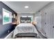 This bedroom features an upholstered headboard and includes a barn door closet at 2932 Valley Ridge Dr, Decatur, GA 30032