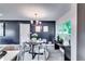 Intimate dining room features modern chandelier and seating for four at 2932 Valley Ridge Dr, Decatur, GA 30032