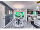 Bright dining area featuring modern lighting and a stylish table set against a backdrop of lush greenery at 2932 Valley Ridge Dr, Decatur, GA 30032