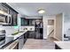 Modern kitchen showcasing stainless steel appliances, granite countertops and sleek black cabinetry at 2932 Valley Ridge Dr, Decatur, GA 30032