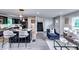 Open concept living area with modern kitchen, seating at center island, and a staircase to the second level at 2932 Valley Ridge Dr, Decatur, GA 30032