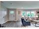 Cozy living room featuring neutral walls, hardwood floors, and a comfortable couch and sitting chairs at 2932 Valley Ridge Dr, Decatur, GA 30032