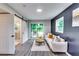 This living room has a sliding glass door, backyard views and an attached bathroom at 2932 Valley Ridge Dr, Decatur, GA 30032