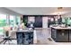 Spacious living room with plenty of natural light, connected to kitchen area with a center island and barstool seating at 2932 Valley Ridge Dr, Decatur, GA 30032