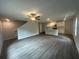 Open concept living space with hardwood floors, a ceiling fan, and natural light at 35 Yellow Brick Way, Covington, GA 30014