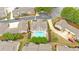 An aerial view shows the neighborhood pool surrounded by manicured landscaping at 1078 Camry Cir, Dallas, GA 30157