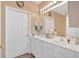 Bright bathroom boasts double sinks, white cabinets, and ample counter space at 1078 Camry Cir, Dallas, GA 30157