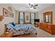 Spacious bedroom features natural light, carpet, neutral walls, and wood furniture at 1078 Camry Cir, Dallas, GA 30157