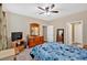 Inviting bedroom with blue comforter, wood furnishings, and natural light at 1078 Camry Cir, Dallas, GA 30157