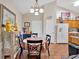 Cozy dining area featuring a table with chairs, a hanging light fixture, and cabinet at 1078 Camry Cir, Dallas, GA 30157