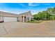 Spacious home with a long driveway leading to an attached two-car garage at 1078 Camry Cir, Dallas, GA 30157