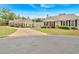 A view of the property featuring a well-manicured lawn and mature trees at 1078 Camry Cir, Dallas, GA 30157